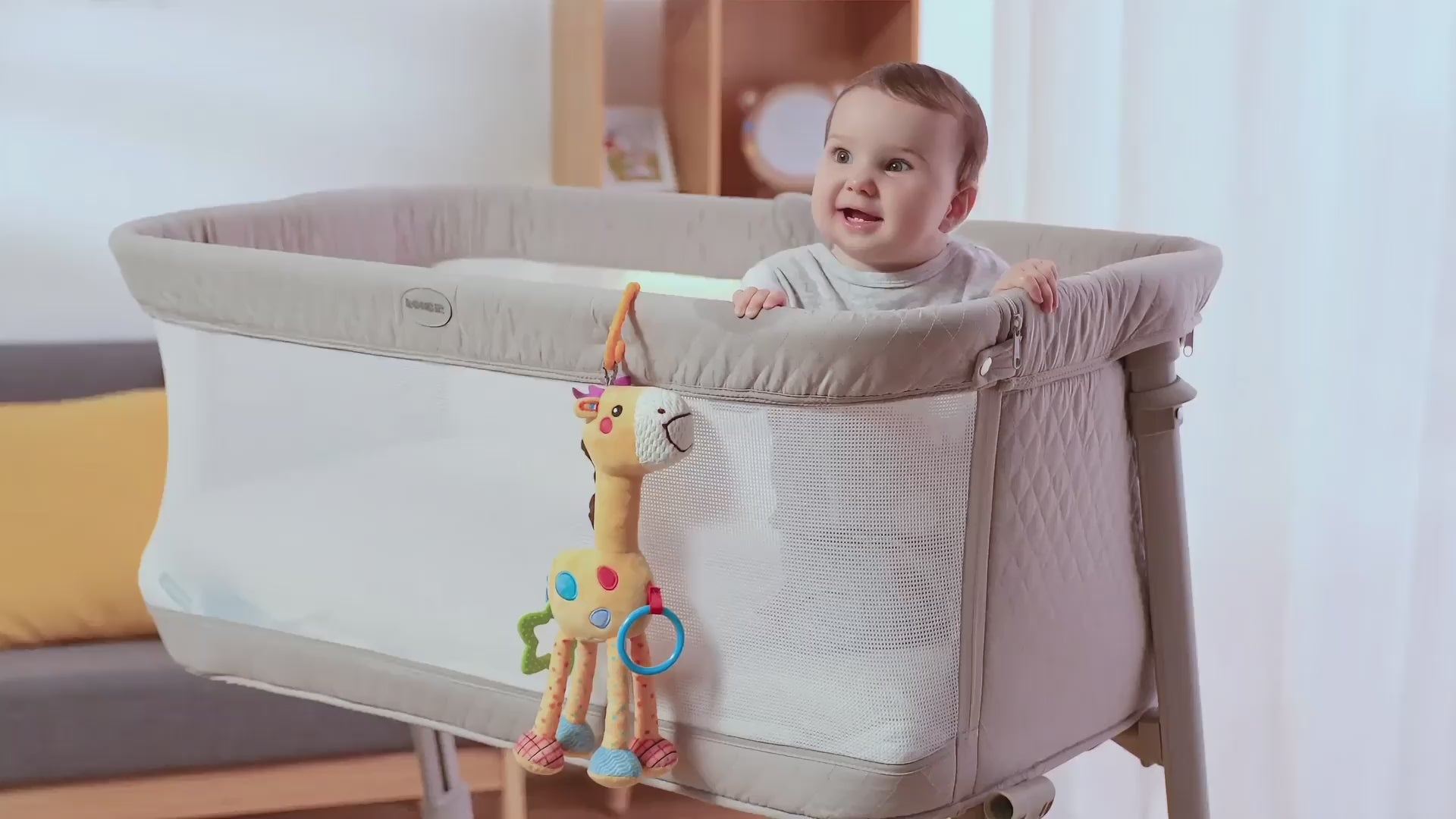 Baby-plays-with-Giraffe-Hanging-rattle-toy-in-stroller