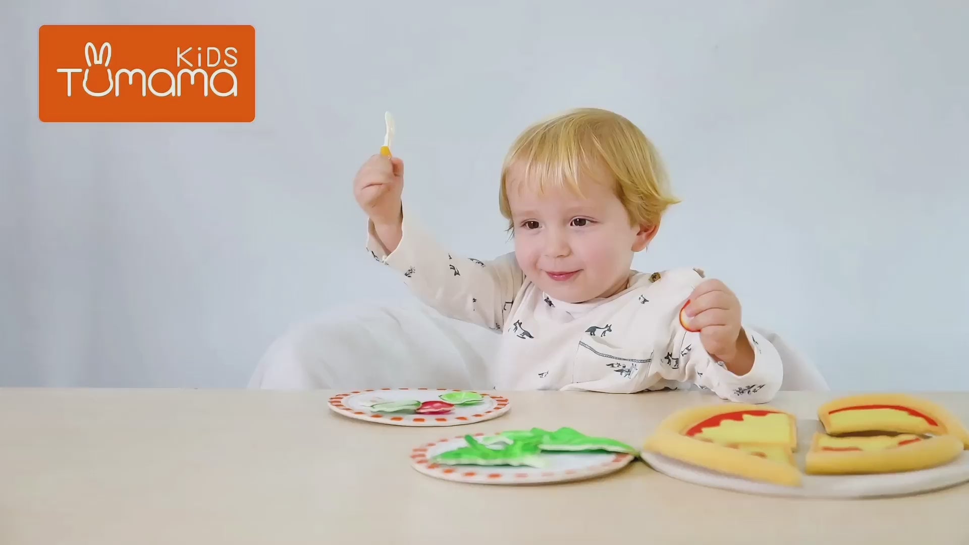 Little-boy-is-playing-with-Pretend-play-pizza-toy