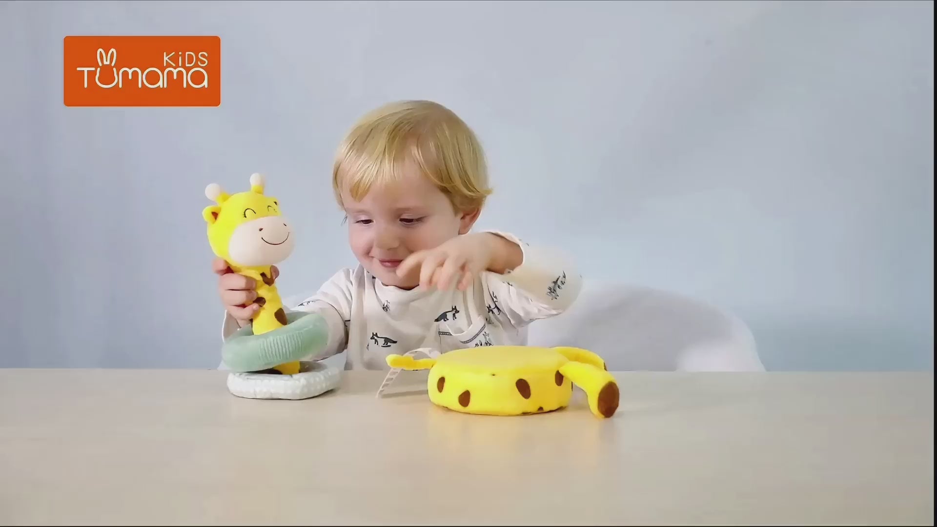 Baby-sitting-on-the-floor-playing-with-Plush-stacking-toys