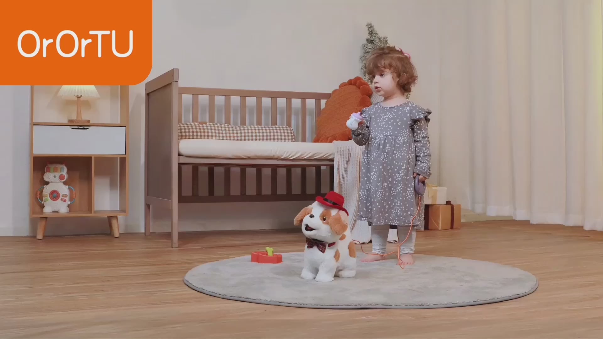 LITTLE GIRL FEEDING HER ELECTRONIC PET DOG