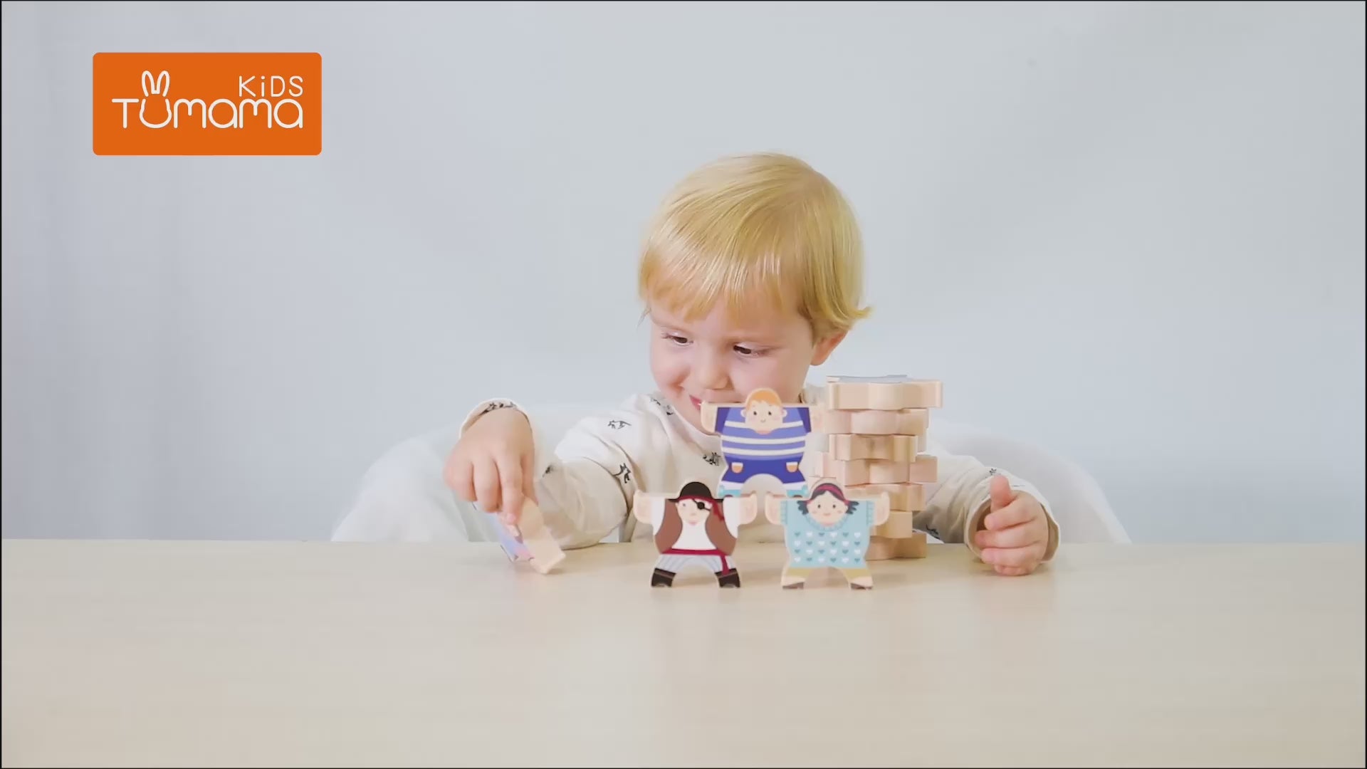 LITTLE-BOY-IS-PLAYING-WITH-STACKING-TOY-BALANCE-BLOCKS